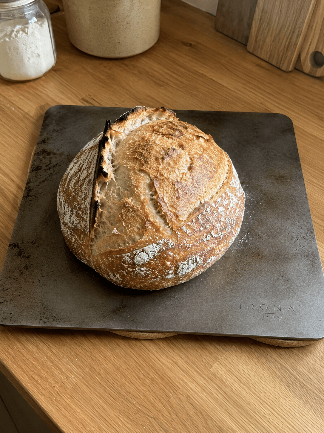 Fresh sourdough loaf on the Irona 38 carbon steel baking plate