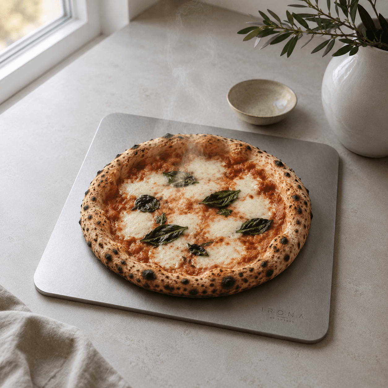 Margherita pizza on the Irona 38 carbon steel baking plate