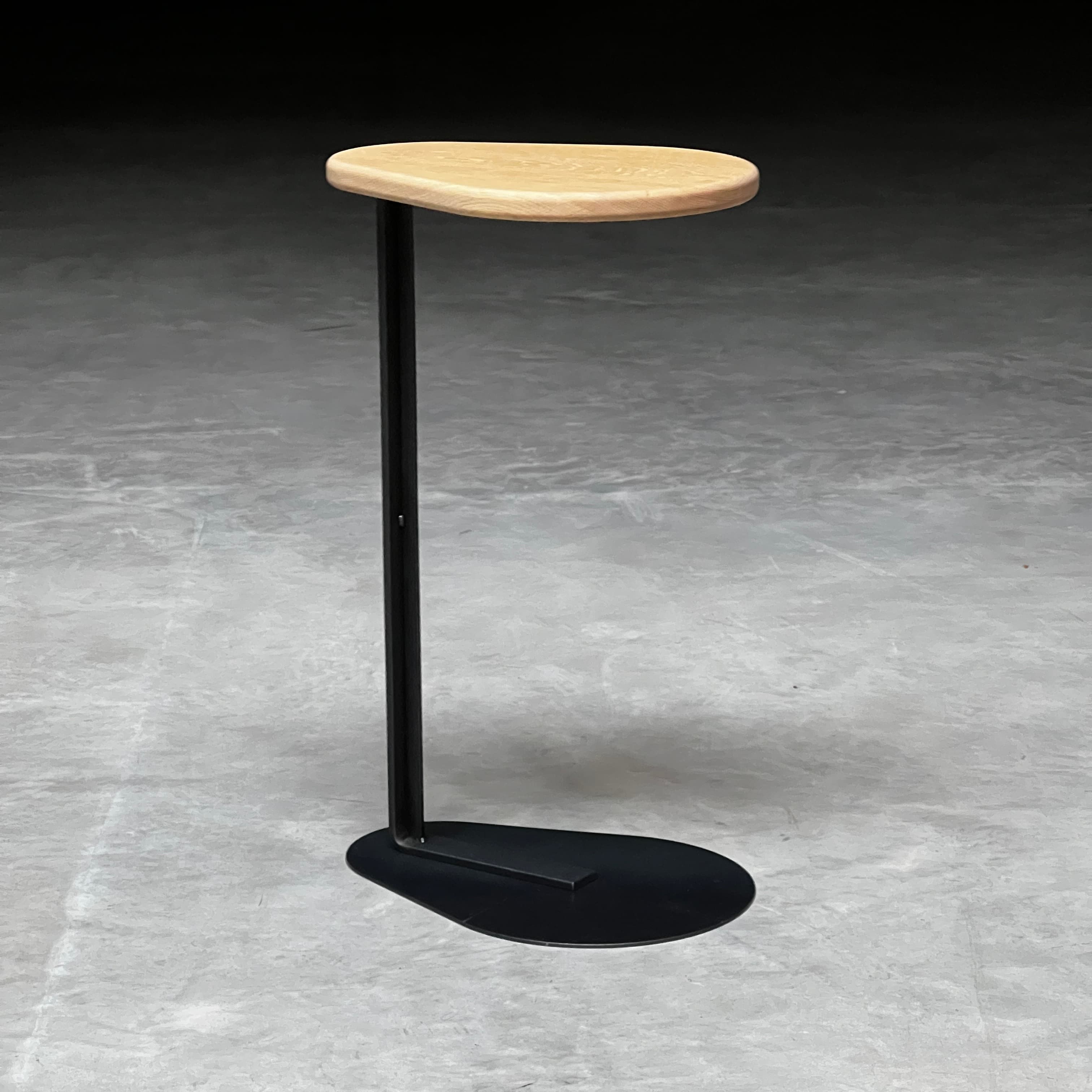 Cantilevered mild steel side table with solid oak top — bespoke commission, Stockholm